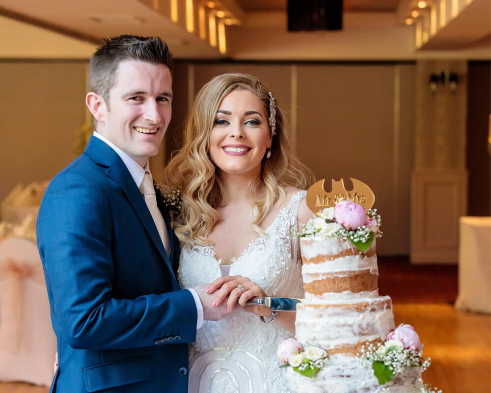 Bride & Groom Cutting Cake