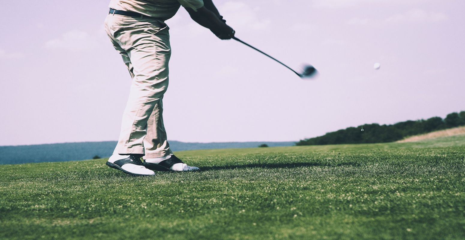 man-in-white-denim-pants-and-black-sandals-playing-golf-114972